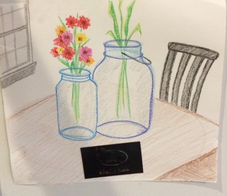 The jars drawn with crayons is hanging on a fridge, but this gives you the idea.